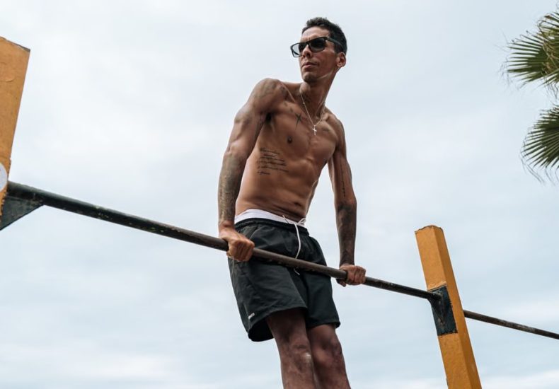 Athletic man practicing calisthenics on a sunny day in Trujillo, Peru.
